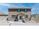 Back exterior view of a two-story home with a patio and outdoor grill at 2177 Shadow Creek Dr, Castle Rock, CO 80104