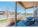 Inviting front porch offers comfortable seating, creating a relaxing outdoor space to enjoy the neighborhood view at 2177 Shadow Creek Dr, Castle Rock, CO 80104
