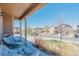 Inviting front porch offers comfortable seating, creating a relaxing outdoor space to enjoy the neighborhood view at 2177 Shadow Creek Dr, Castle Rock, CO 80104