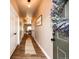 Inviting entryway featuring wood floors, neutral walls, and a charming wreath, creating a warm and welcoming ambiance at 2177 Shadow Creek Dr, Castle Rock, CO 80104