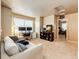 Cozy living room with a seating area, desk, and a doorway to another room at 2177 Shadow Creek Dr, Castle Rock, CO 80104