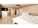 Bright main bedroom offering generous space, with a view of the en suite bathroom and walk-in closet at 2177 Shadow Creek Dr, Castle Rock, CO 80104
