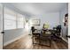 Bright home office with wood floors, large window, and modern desk setup at 2177 Shadow Creek Dr, Castle Rock, CO 80104