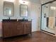 Bathroom with a double sink vanity and a modern glass enclosed shower at 1618 Garnet St, Broomfield, CO 80020