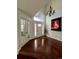 Welcoming entryway with gleaming hardwood floors, a modern chandelier, and a view of the front porch at 1618 Garnet St, Broomfield, CO 80020