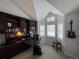 Home office featuring built-in bookshelves, a large desk, and multiple windows for ample natural light at 1618 Garnet St, Broomfield, CO 80020