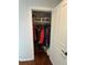 A walk-in closet with ample space for shoes, wine storage, and multiple rows of hanging space at 1618 Garnet St, Broomfield, CO 80020