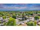 A charming home nestled among mature trees in a quiet neighborhood at 8259 Nola Dr, Denver, CO 80221