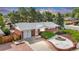Inviting brick home with a lovely landscaped yard, garage, and appealing curb appeal at 8259 Nola Dr, Denver, CO 80221
