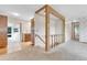 Spacious hallway with carpeted floors leading to the kitchen and other rooms at 8259 Nola Dr, Denver, CO 80221