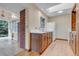 Functional kitchen with wooden cabinets, white appliances, and hardwood floors at 8259 Nola Dr, Denver, CO 80221