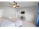 Bright bedroom featuring a ceiling fan, TV, and a dedicated workspace at 2715 E 131St Ave, Thornton, CO 80241