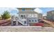 Multi-level back of house featuring deck, stairs to yard, and stone accents at 3925 W 149Th Ave, Broomfield, CO 80023