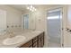 Bathroom with double vanity, a mosaic backsplash, a large mirror, and a separate toilet and shower area at 3925 W 149Th Ave, Broomfield, CO 80023