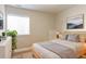 Cozy bedroom with a large window, neutral walls, and modern decor at 3925 W 149Th Ave, Broomfield, CO 80023