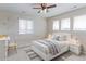 Bedroom featuring a bed, a study desk, windows with blinds, and bright, natural light and decor at 3925 W 149Th Ave, Broomfield, CO 80023