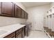 Well-organized laundry room with modern washer/dryer, ample counter space, and storage cabinets at 3925 W 149Th Ave, Broomfield, CO 80023