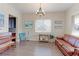 Inviting living room featuring hardwood floors, a comfortable leather sofa, and natural light at 3925 W 149Th Ave, Broomfield, CO 80023