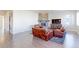 Spacious living room with a stone fireplace, hardwood floors, and comfortable seating arrangement at 3925 W 149Th Ave, Broomfield, CO 80023