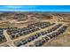 High angle aerial view of homes in a community with mountain terrain in the distance at 6673 Mentha Dr, Castle Rock, CO 80108