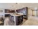 Spacious kitchen features granite countertops, stainless steel appliances, and a large center island at 6673 Mentha Dr, Castle Rock, CO 80108
