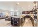 Open-concept kitchen with granite countertops, stainless steel appliances, and ample cabinet space at 6673 Mentha Dr, Castle Rock, CO 80108