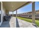 Covered patio overlooking a well-maintained lawn and landscape at 6673 Mentha Dr, Castle Rock, CO 80108