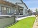 Beautiful backyard with a putting green, hot tub, and covered patio at 11464 Stonewash St, Littleton, CO 80125