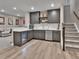 Basement bar area features a beverage cooler, attractive cabinets, and white tile backsplash at 11464 Stonewash St, Littleton, CO 80125
