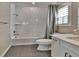 Full bathroom with white subway tile, soaking tub and modern white vanity at 11464 Stonewash St, Littleton, CO 80125