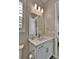 Stylish bathroom with white vanity, quartz countertop, modern faucet, and ample lighting at 11464 Stonewash St, Littleton, CO 80125