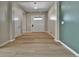 Bright entryway features light wood flooring and modern paint accents at 11464 Stonewash St, Littleton, CO 80125
