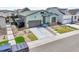 Charming two-story home with a two car garage, stone accents, well manicured lawn and driveway at 11464 Stonewash St, Littleton, CO 80125