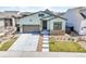 Charming two-story home with a two car garage, stone accents, well manicured lawn and driveway at 11464 Stonewash St, Littleton, CO 80125