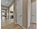 Inviting hallway with wood flooring, neutral paint, and modern white trim at 11464 Stonewash St, Littleton, CO 80125