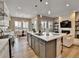 Gourmet kitchen with large center island, stainless appliances, and an open floor plan at 11464 Stonewash St, Littleton, CO 80125