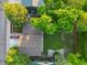 Aerial view of a well-maintained property with lush green yard and mature trees at 9123 W Arbor Ave, Littleton, CO 80123