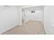 Finished basement with neutral carpet and a window, illuminated by recessed lighting at 9123 W Arbor Ave, Littleton, CO 80123