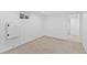 Finished basement with a window, carpet flooring, and painted white walls at 9123 W Arbor Ave, Littleton, CO 80123