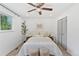 Well-lit bedroom with a ceiling fan, and closet offering ample storage space at 9123 W Arbor Ave, Littleton, CO 80123