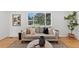 Comfortable living room featuring hardwood floors, and a large window at 9123 W Arbor Ave, Littleton, CO 80123
