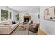 Inviting living room with fireplace, neutral palette, and great natural light at 9123 W Arbor Ave, Littleton, CO 80123