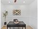 Cozy office with a modern black desk, stylish wall art, and a decorative plant at 9123 W Arbor Ave, Littleton, CO 80123