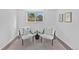 Cozy sitting area with two chairs, a small table, and a window overlooking the backyard at 9123 W Arbor Ave, Littleton, CO 80123
