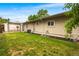 A spacious backyard with a well-maintained lawn and a pergola provides a relaxing outdoor space at 404 S Jasmine St, Denver, CO 80224