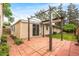 Backyard patio features a brick floor, backyard landscaping, and a pergola over the patio at 404 S Jasmine St, Denver, CO 80224