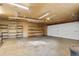 Spacious garage with shelving and ample room for parking and storage, offering practical functionality at 404 S Jasmine St, Denver, CO 80224
