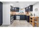 The kitchen is equipped with stainless steel appliances and granite countertops at 404 S Jasmine St, Denver, CO 80224