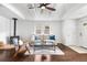 Bright living room with vaulted ceilings, hardwood floors, neutral paint, and comfortable seating at 404 S Jasmine St, Denver, CO 80224