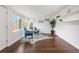 Bright living room showcasing hardwood floors, large windows, and modern décor, with cozy seating at 404 S Jasmine St, Denver, CO 80224